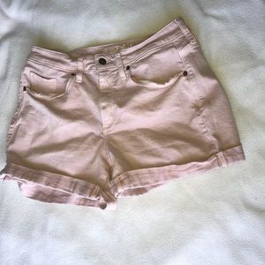 Blush pink jean shorts.